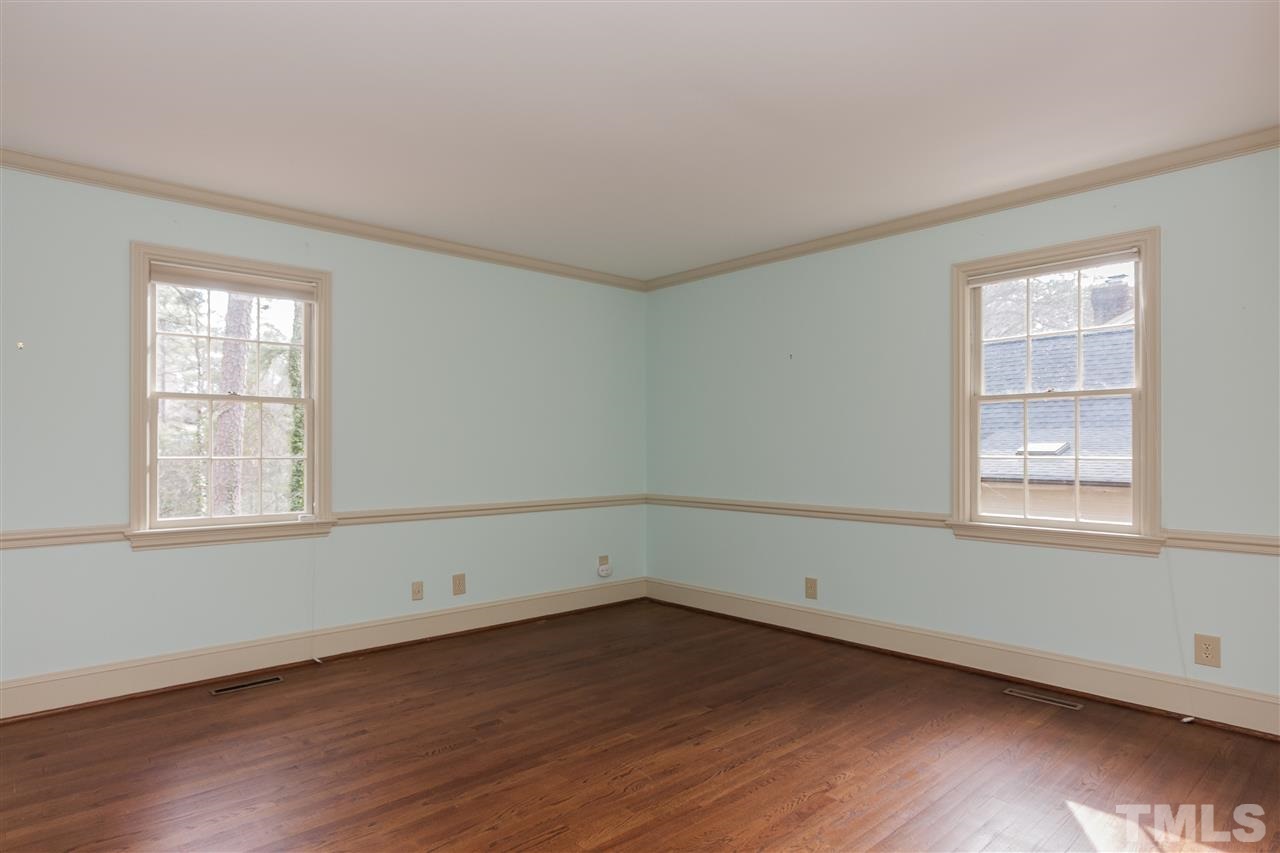 3400 Landor Road Raleigh, NC 27609 - Photo 15 of 25 an empty room with wooden floor and windows