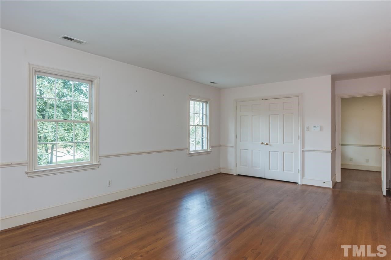 3400 Landor Road Raleigh, NC 27609 - Photo 18 of 25 a view of an empty room with wooden floor and a window