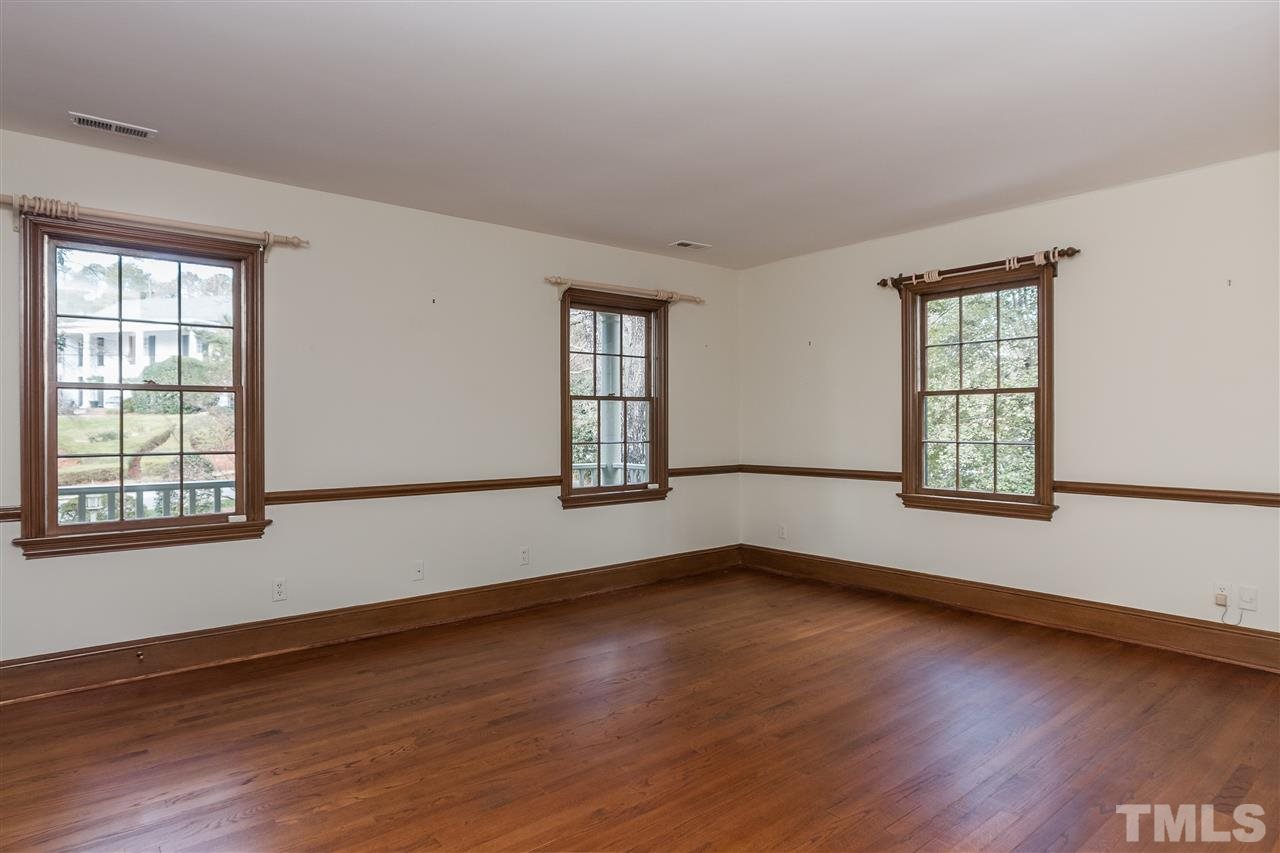 3400 Landor Road Raleigh, NC 27609 - Photo 19 of 25 an empty room with wooden floor and windows