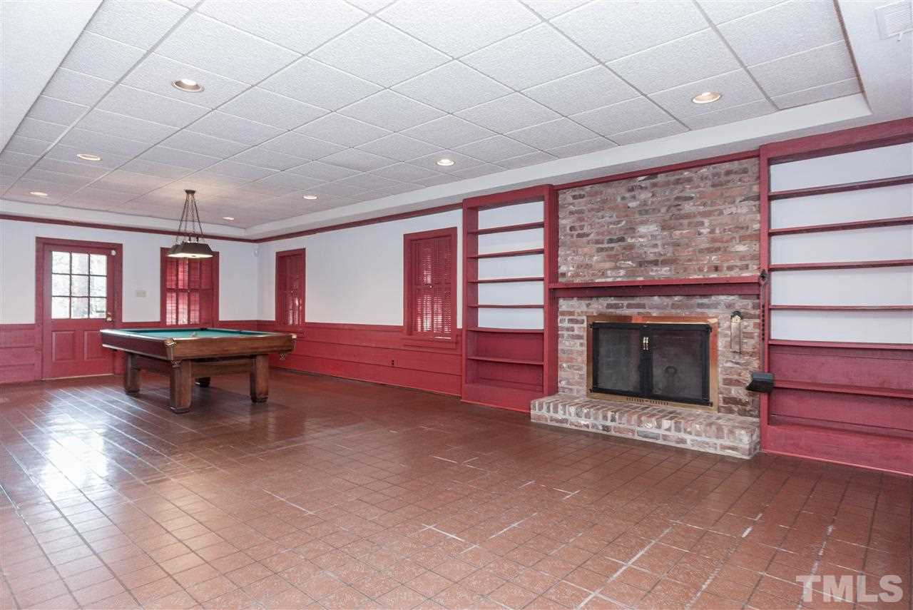 3400 Landor Road Raleigh, NC 27609 - Photo 20 of 25 a living room with furniture and a fireplace