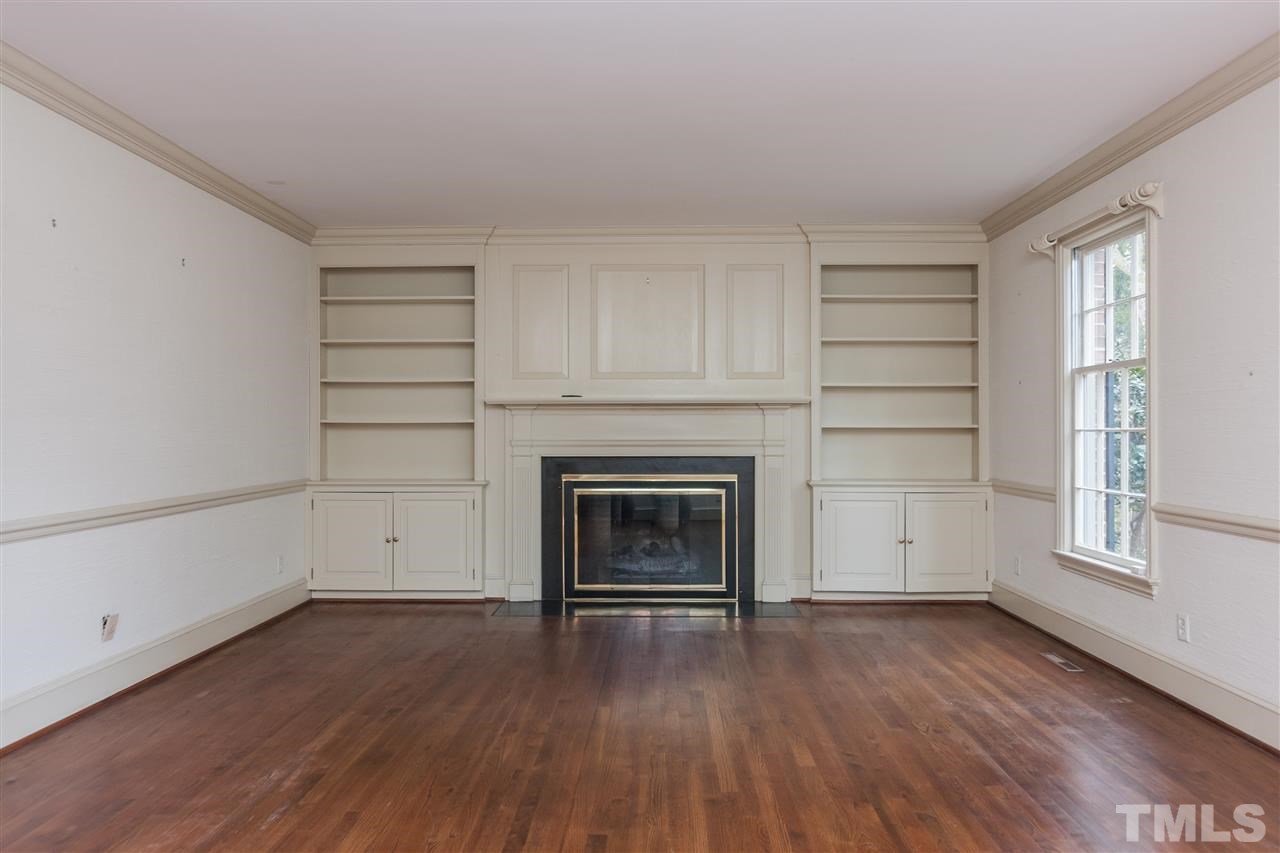 3400 Landor Road Raleigh, NC 27609 - Photo 5 of 25 wooden floor fireplace and windows in an empty room