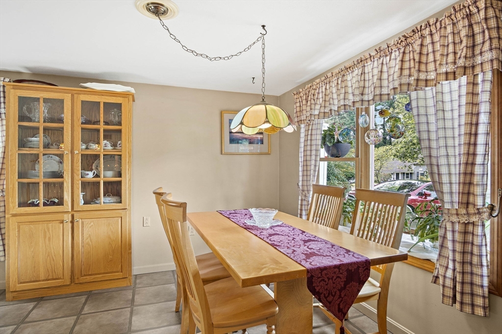 21 Kelsey Road Natick, MA 01760 - Photo 13 of 34 a view of a dining room with furniture window and outside view