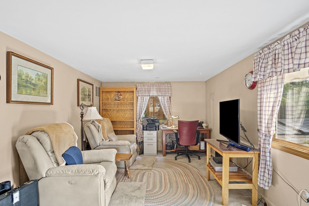 21 Kelsey Road Natick, MA 01760 - Photo 15 of 34 a living room with furniture and a flat screen tv