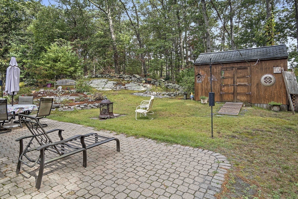 21 Kelsey Road Natick, MA 01760 - Photo 27 of 34 a view of a backyard with sitting area