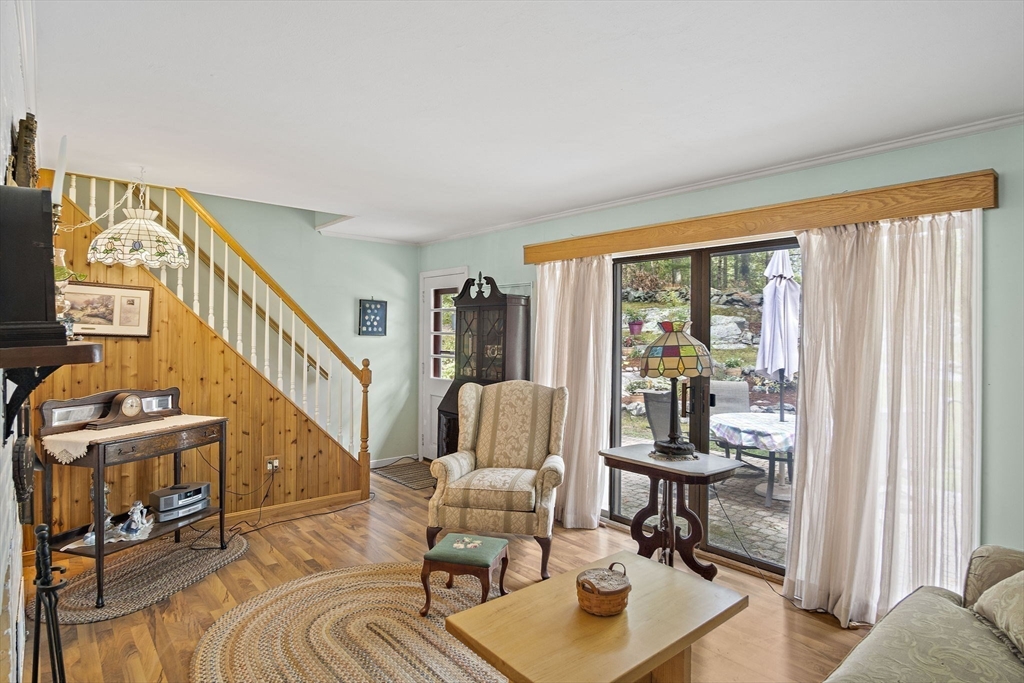 21 Kelsey Road Natick, MA 01760 - Photo 3 of 34 a living room with furniture and a floor to ceiling window