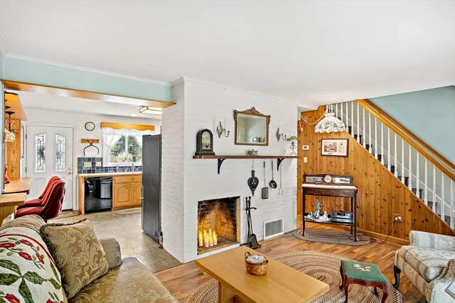 a living room with furniture fireplace and a flat screen tv