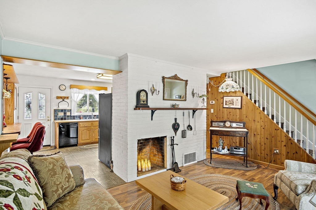 21 Kelsey Road Natick, MA 01760 - Photo 4 of 34 a living room with furniture fireplace and a flat screen tv