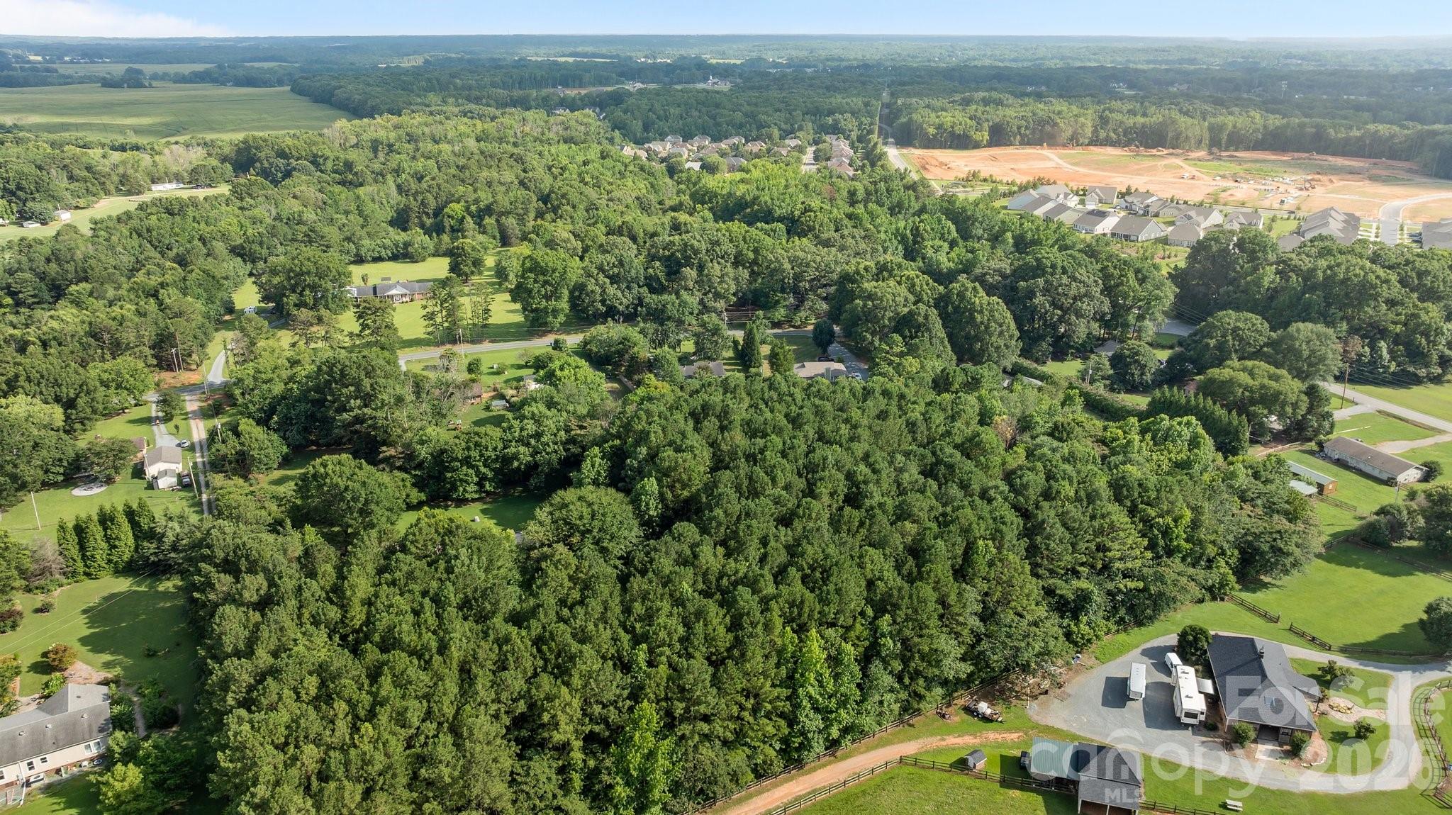 1108 Willoughby Road Monroe, NC 28110 - Photo 42 of 48 an aerial view of residential houses with outdoor space and trees