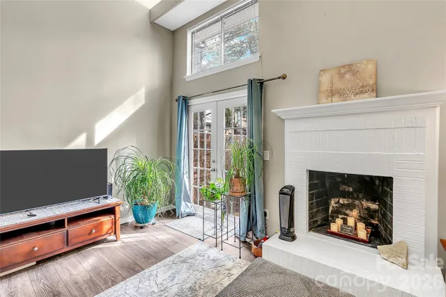 a kitchen with stainless steel appliances a stove and white cabinets