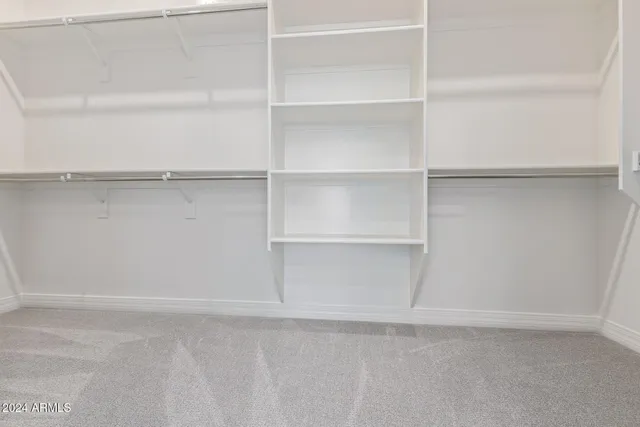 a view of an empty walk in closet