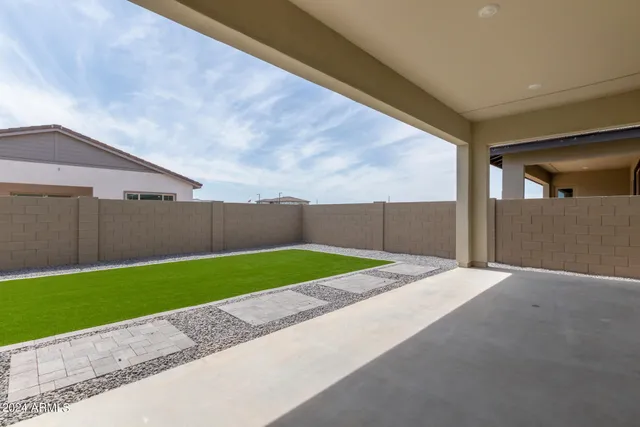 a view of backyard with green space