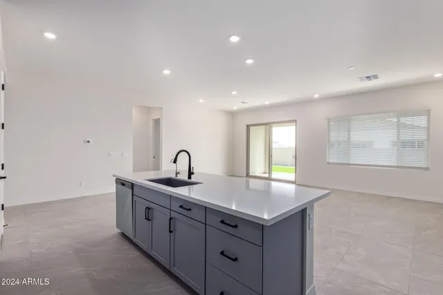 a kitchen with sink and window