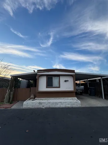 a front view of a house with parking space
