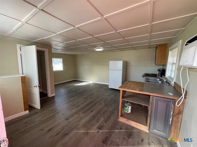 a room with wooden floor and furniture