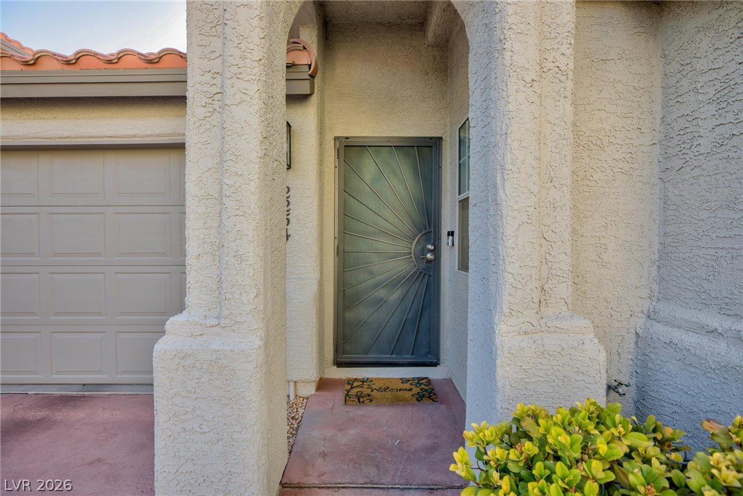 2254 Ramsgate Drive Henderson, NV 89074 - Photo 29 of 43 Secure, ornate entry door welcomes you into this charming residence, complete with a convenient attached garage.
