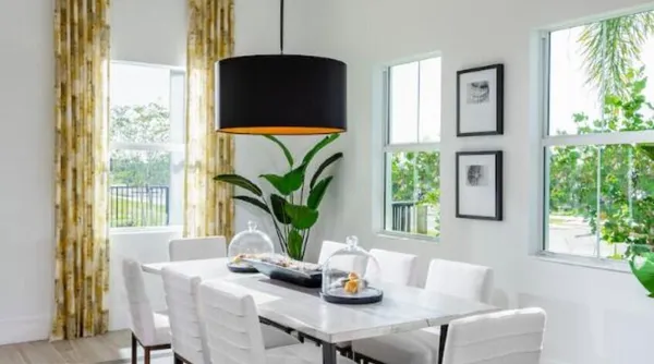 a dining room with furniture and window