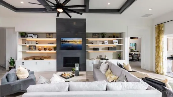 a living room with furniture and a fireplace