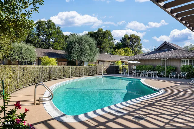 a view of a swimming pool with a patio