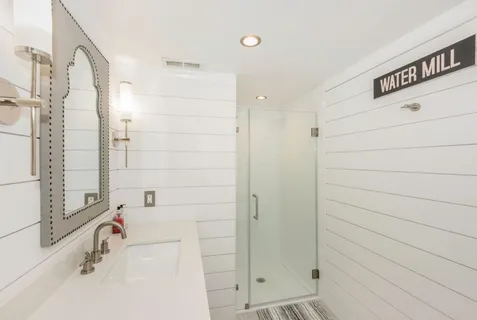 a bathroom with a bathtub and shower