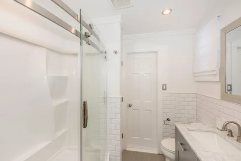 a bathroom with a sink and shower