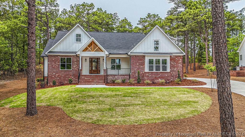 113 Pittman Road West End, NC 27376 - Photo 1 of 50 a front view of a house with a yard