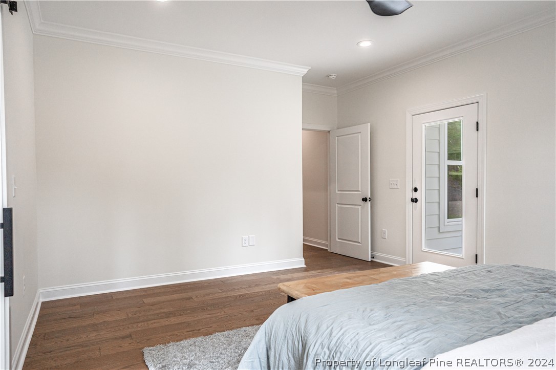 113 Pittman Road West End, NC 27376 - Photo 19 of 50 a bedroom with a bed and wooden floor