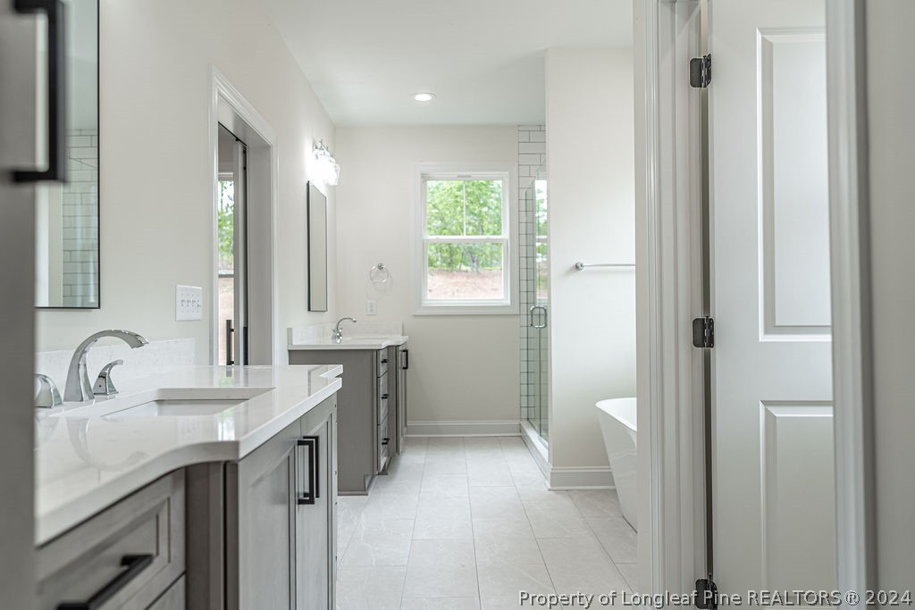 113 Pittman Road West End, NC 27376 - Photo 20 of 50 a bathroom with a sink a toilet and a mirror