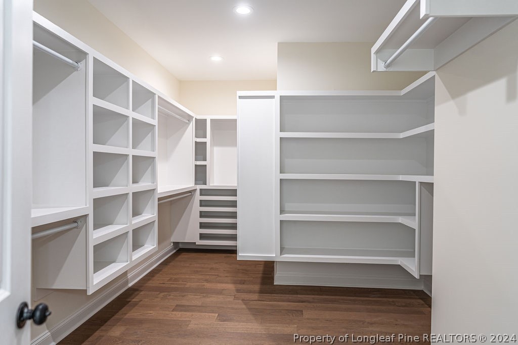 113 Pittman Road West End, NC 27376 - Photo 24 of 50 a view of walk in closet with empty racks