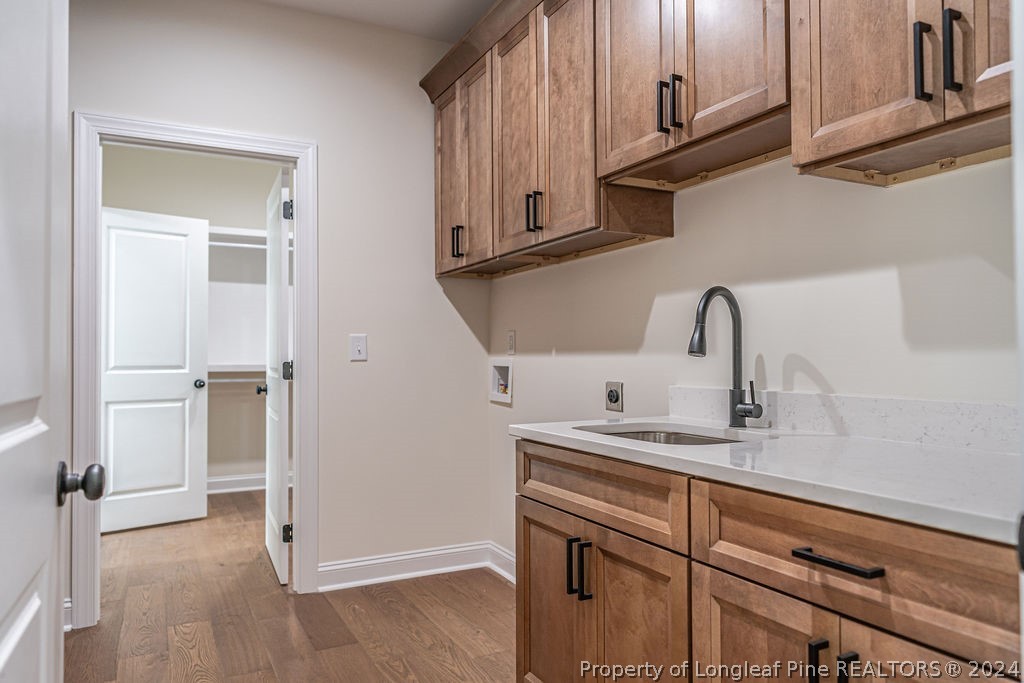 113 Pittman Road West End, NC 27376 - Photo 25 of 50 a kitchen with stainless steel appliances granite countertop white cabinets and a sink