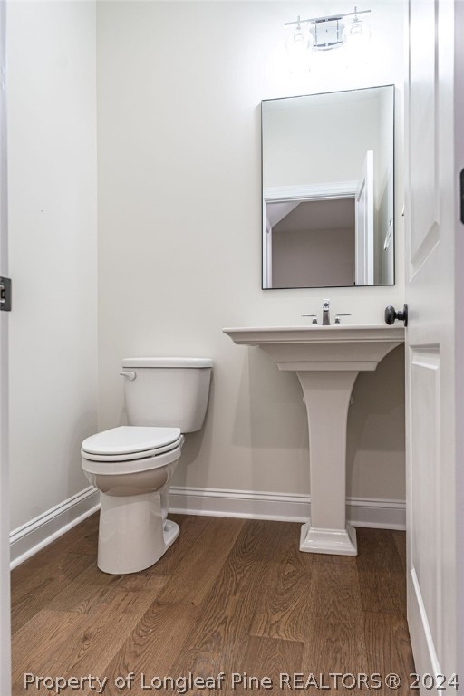 113 Pittman Road West End, NC 27376 - Photo 27 of 50 a bathroom with a toilet sink and mirror