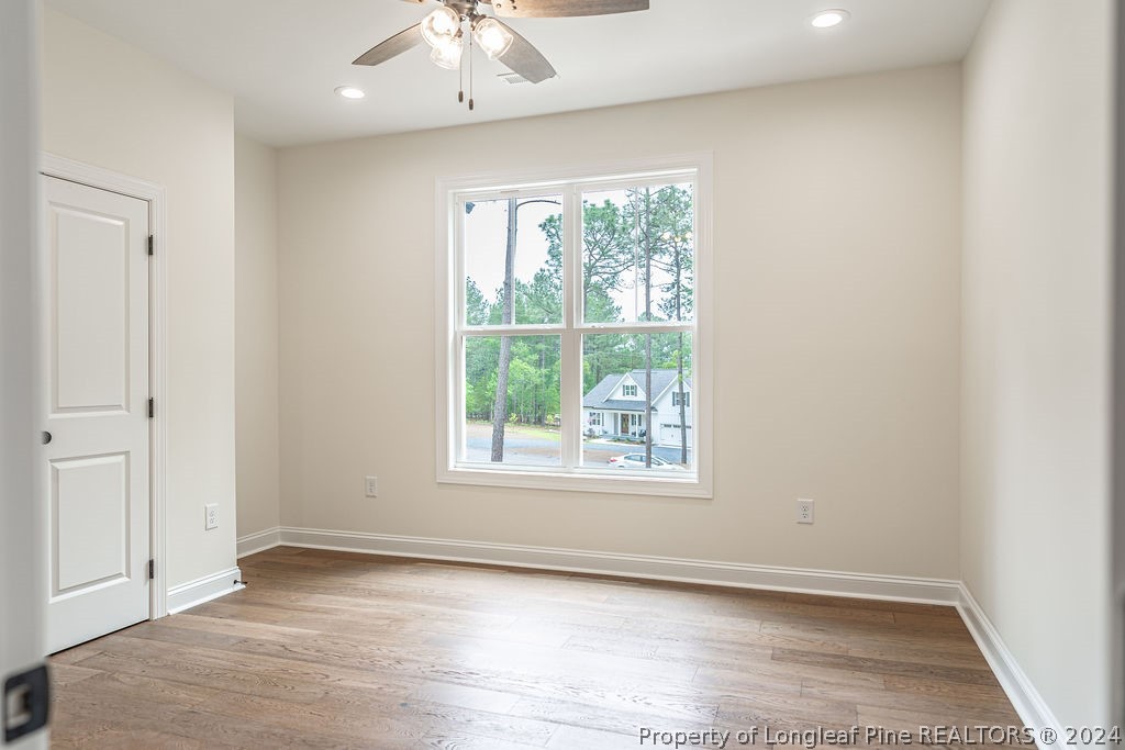 113 Pittman Road West End, NC 27376 - Photo 29 of 50 an empty room with wooden floor and windows