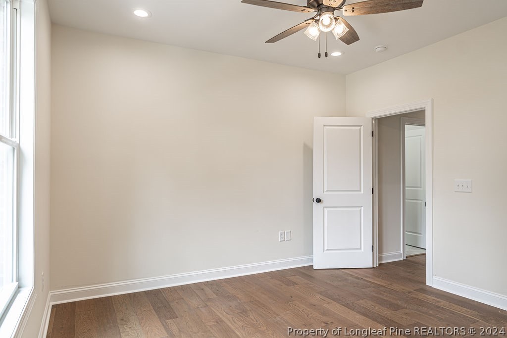 113 Pittman Road West End, NC 27376 - Photo 30 of 50 an empty room with a ceiling fan and carpet