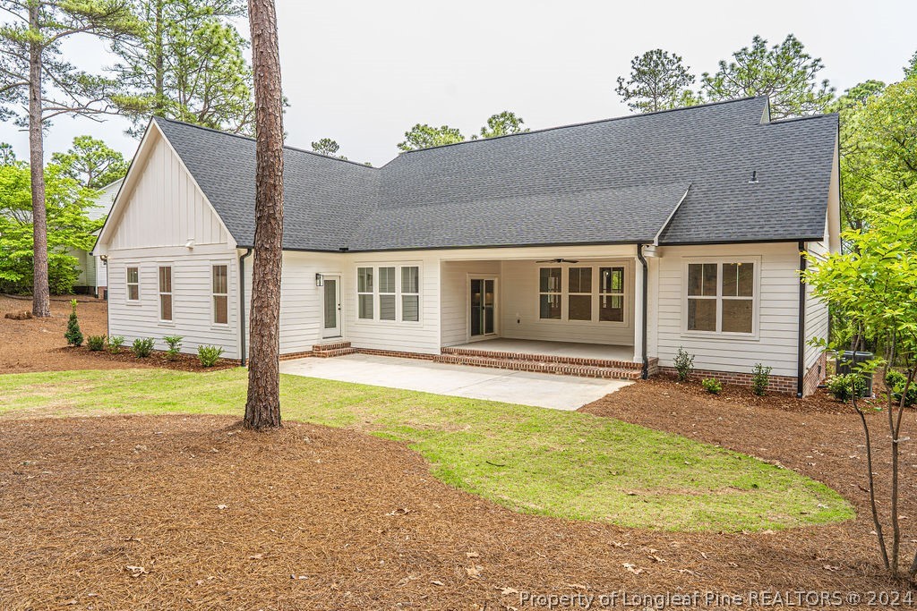 113 Pittman Road West End, NC 27376 - Photo 41 of 50 a front view of a house with a garden and patio