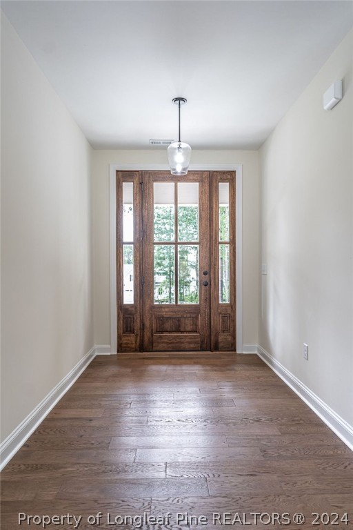 113 Pittman Road West End, NC 27376 - Photo 5 of 50 an empty room with wooden floor and windows