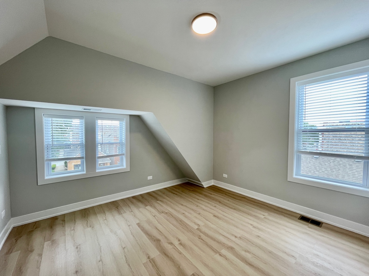 2238 West 24th Street, Unit 2F Chicago, IL 60608 - Photo 17 of 25 an empty room with wooden floor and windows