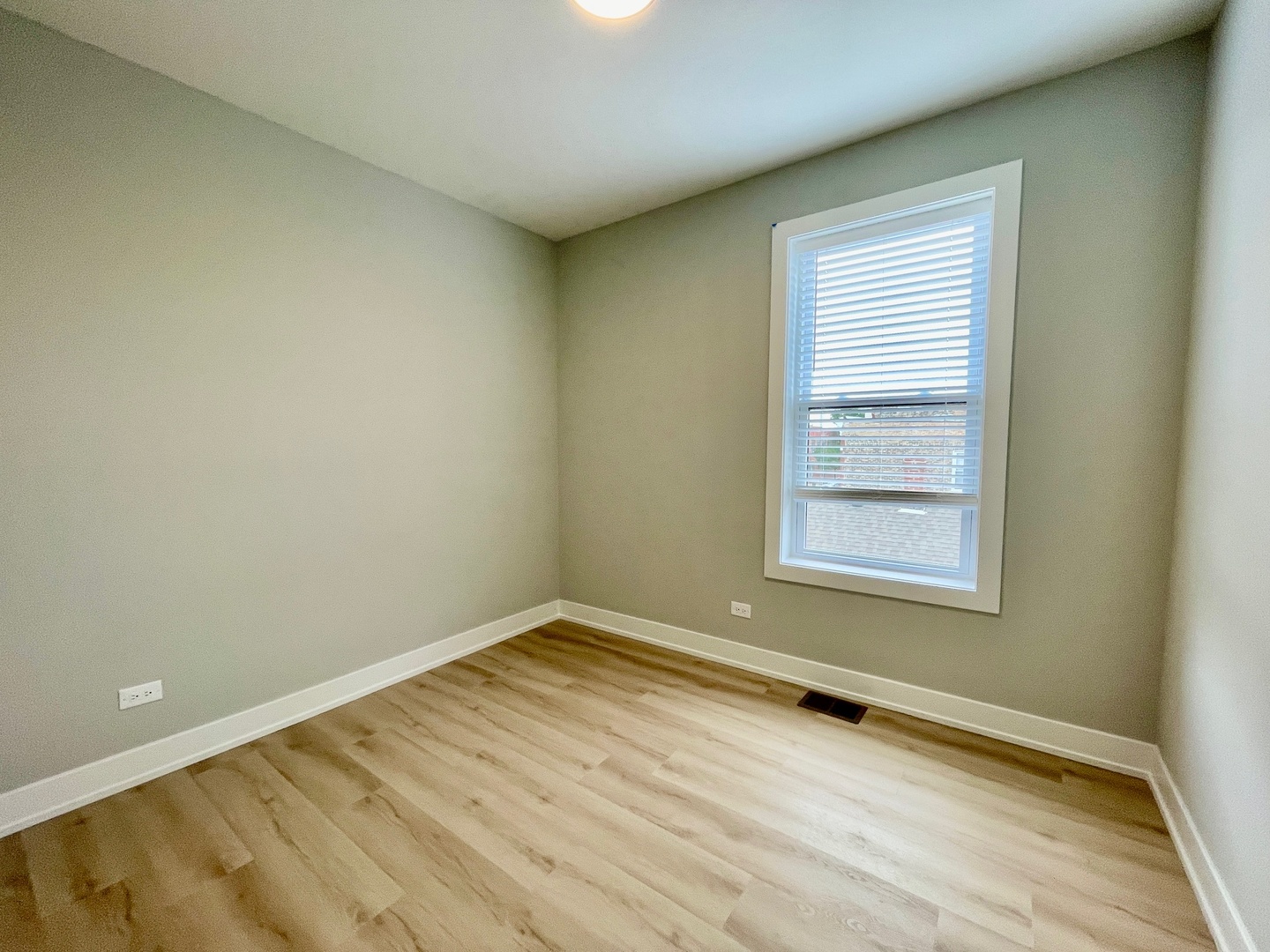 2238 West 24th Street, Unit 2F Chicago, IL 60608 - Photo 20 of 25 an empty room with a window