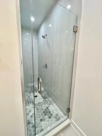 a bathroom with a sink mirror and toilet