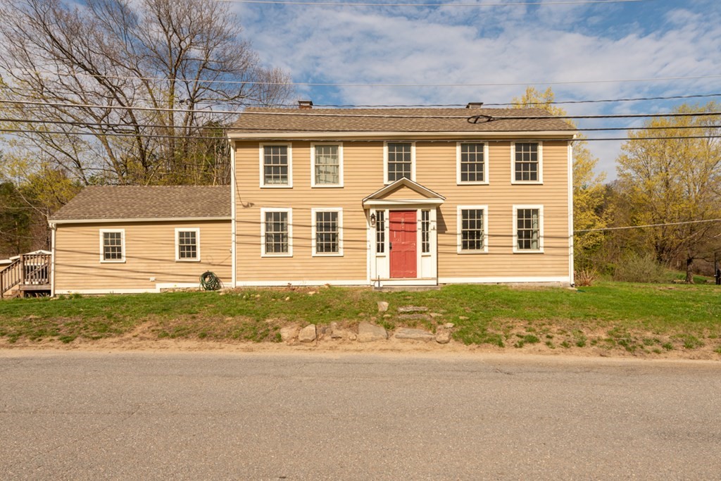 front view of a house with a yard