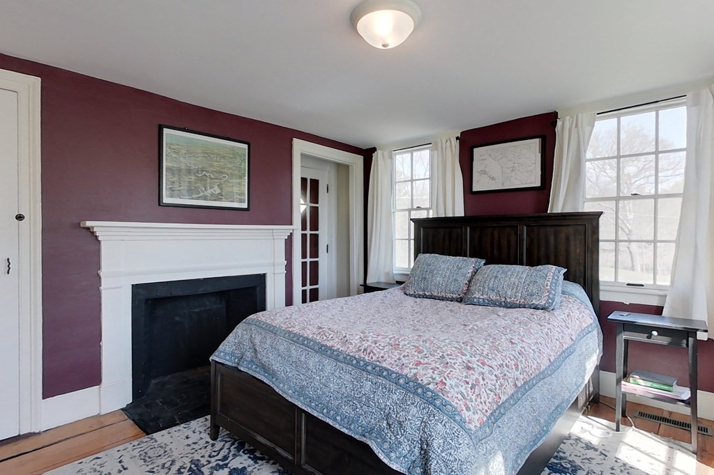 95 South Road Ashby, MA 01431 - Photo 11 of 33 a bedroom with a large bed and a fireplace