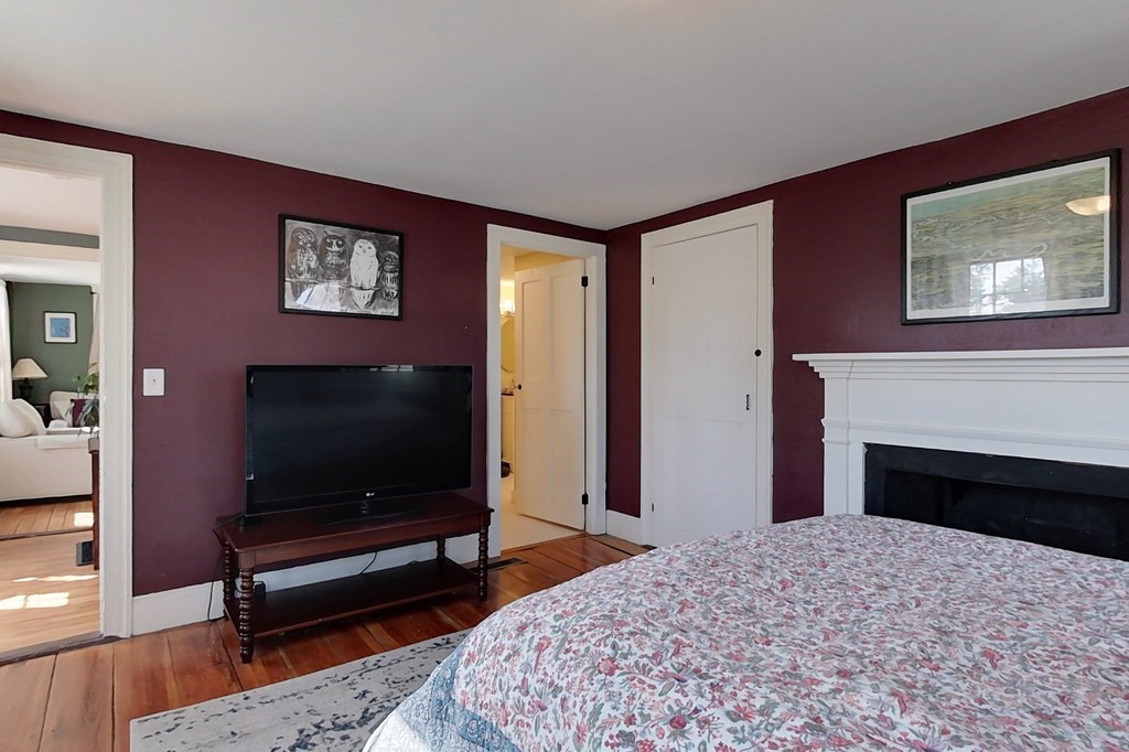95 South Road Ashby, MA 01431 - Photo 13 of 33 a living room with a flat screen tv and a fireplace