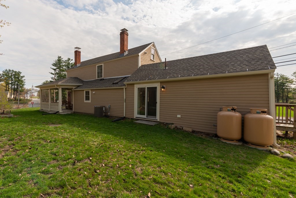 95 South Road Ashby, MA 01431 - Photo 2 of 33 a front view of a house with a garden
