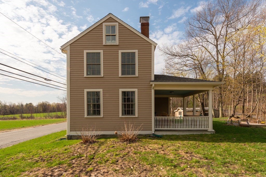 95 South Road Ashby, MA 01431 - Photo 22 of 33 a front view of a house with garden