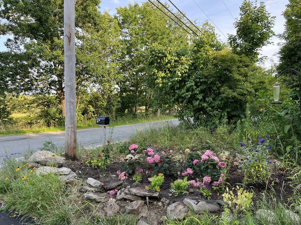 95 South Road Ashby, MA 01431 - Photo 28 of 33 a front view of a house with a yard and fountain