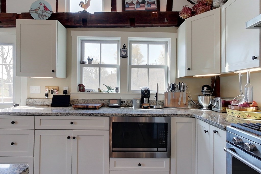 95 South Road Ashby, MA 01431 - Photo 4 of 33 a kitchen with stainless steel appliances granite countertop a sink stove and cabinets