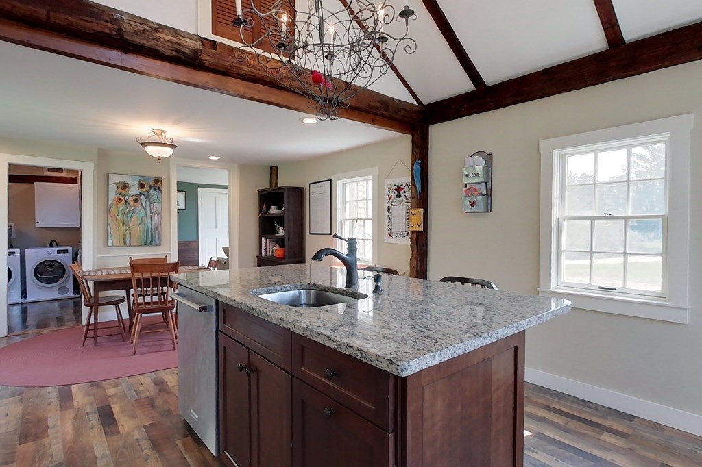 95 South Road Ashby, MA 01431 - Photo 5 of 33 a kitchen with center island table and chairs in it