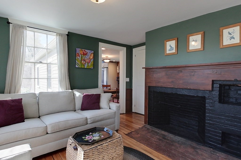 95 South Road Ashby, MA 01431 - Photo 10 of 33 a living room with furniture a flat screen tv and a fireplace