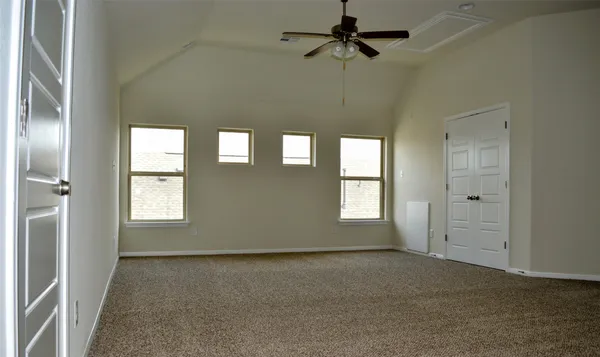 a view of empty room with windows