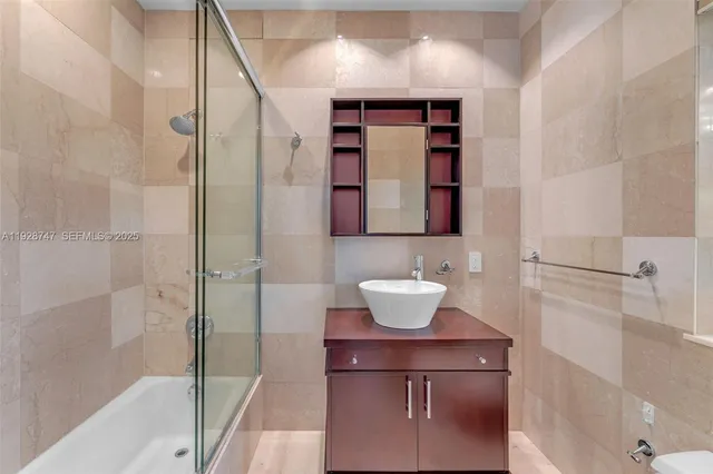 a bedroom with a bed mirror and window