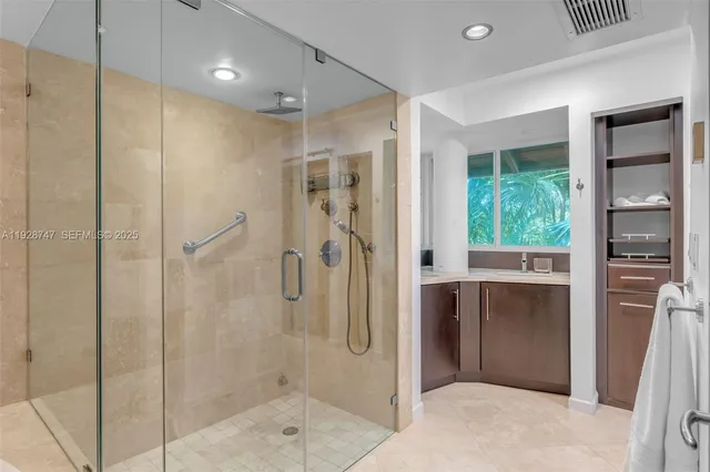 a bathroom with a toilet sink and a shower