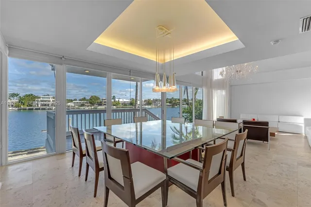 a large kitchen with stainless steel appliances granite countertop a sink and cabinets